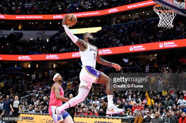 LeBron James of the Los Angeles Lakers dunks the ball in the fourth quarter against the Washington Wizards at Capital One Arena on December 04, 2022...