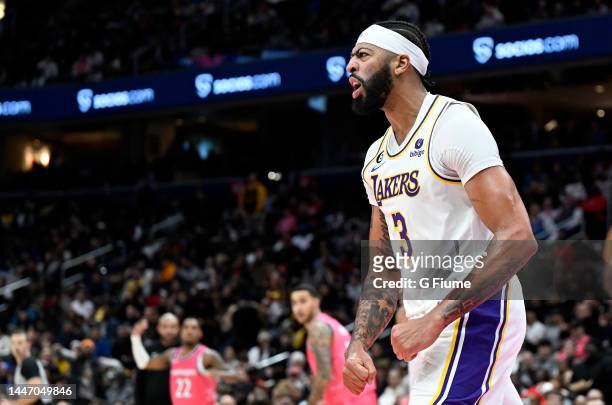 Anthony Davis of the Los Angeles Lakers celebrates after dunking the ball against the Washington Wizards at Capital One Arena on December 04, 2022 in...