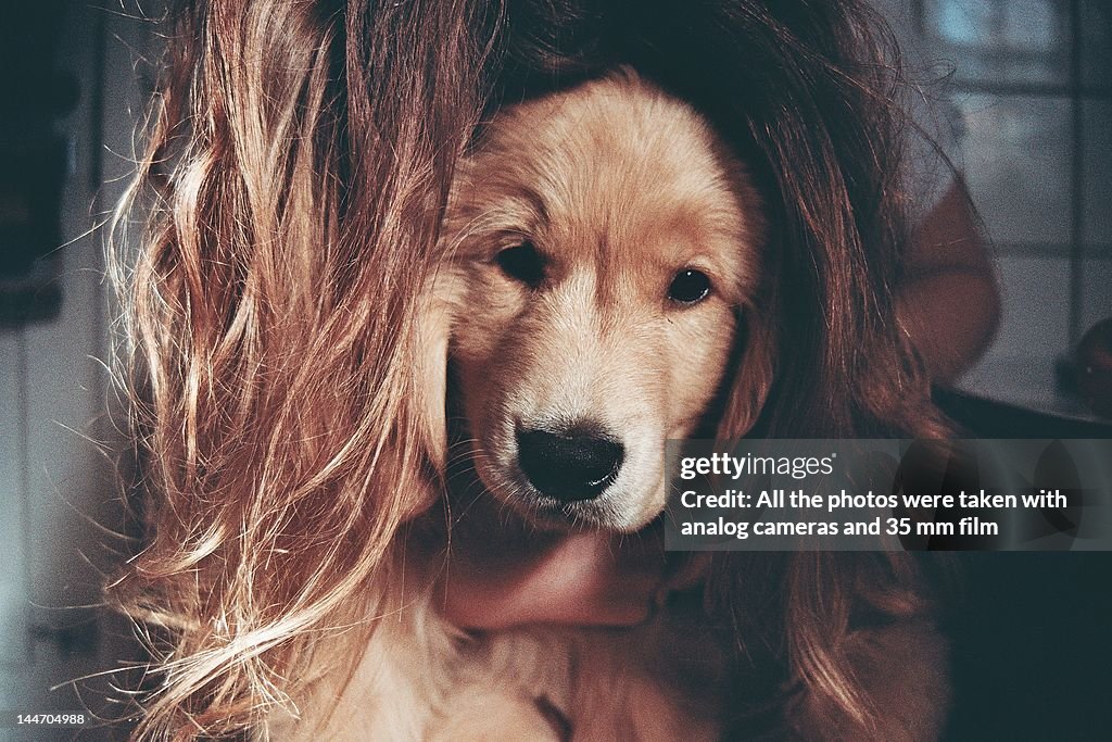 Girl hugging her dog