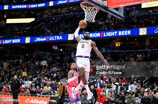 LeBron James of the Los Angeles Lakers dunks the ball in the fourth quarter against the Washington Wizards at Capital One Arena on December 04, 2022...