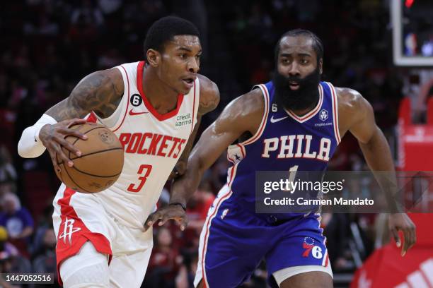 Kevin Porter Jr. #3 of the Houston Rockets controls the ball ahead of James Harden of the Philadelphia 76ers during the first half at Toyota Center...