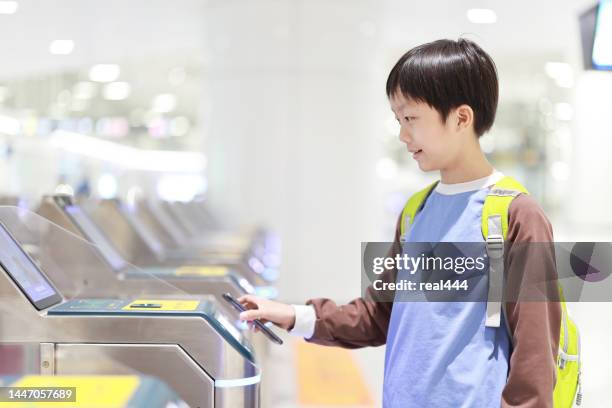 contactless payment at subway train station using a smartphone - metro smart card stock pictures, royalty-free photos & images