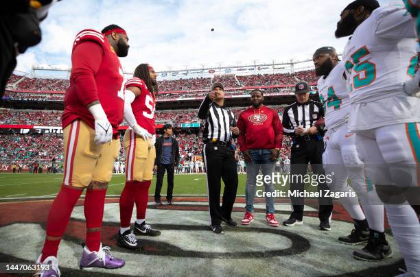 Captains of the San Francisco 49ers and the Miami Dolphins at midfield during the coin toss before the game at Levi's Stadium on December 4, 2022 in...