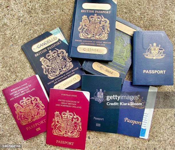 expired uk + au travel passports - old british passport stock pictures, royalty-free photos & images