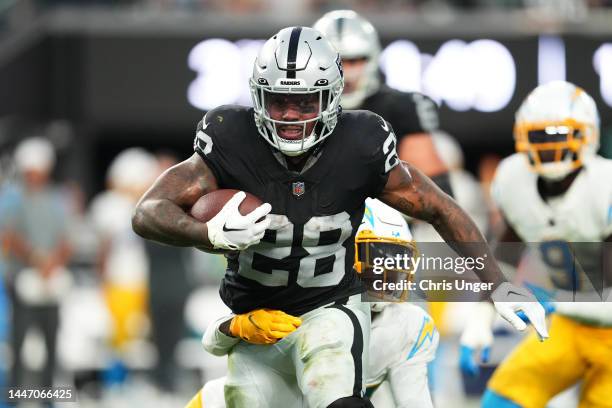 Running back Josh Jacobs of the Las Vegas Raiders runs against the Los Angeles Chargers in the second half of a game at Allegiant Stadium on December...