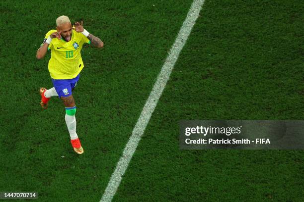 Neymar of Brazil celebrates after scoring the team's second goal via a penalty during the FIFA World Cup Qatar 2022 Round of 16 match between Brazil...