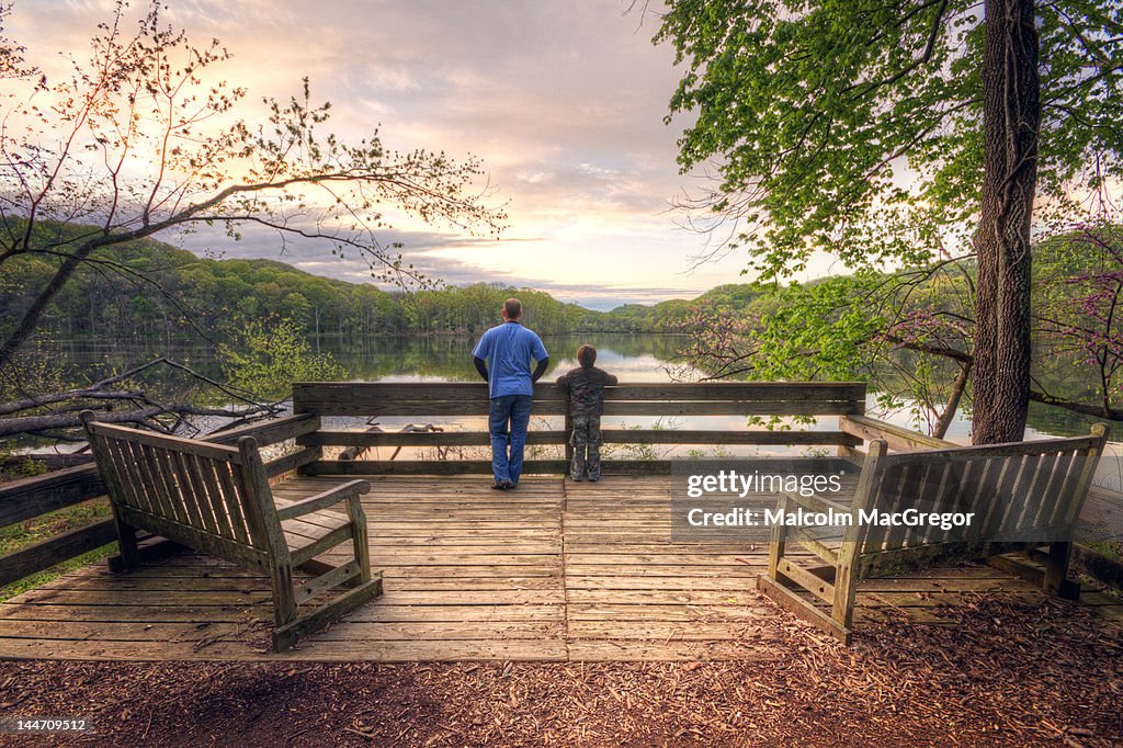 Father and son enjoying sunrise