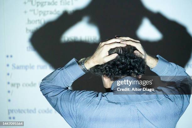 the code does not work! a person shows a programming code to his students on the blackboard. - hands behind head stock pictures, royalty-free photos & images