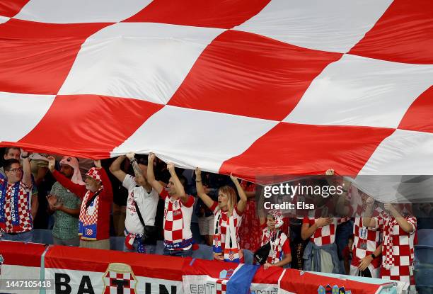 Croatia fans hold a giant Croatia flag before the opening kickoff against Japan during the FIFA World Cup Qatar 2022 Round of 16 match between Japan...