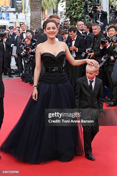 Marion Cotillard and Armand Verdure attend "De Rouille et D'os" Premiere at Palais des Festivals on May 17, 2012 in Cannes, France.