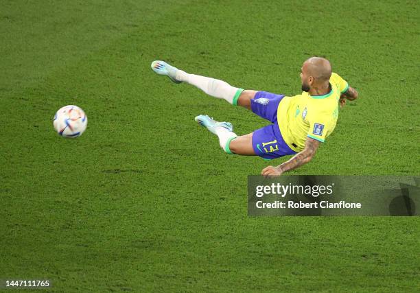 Dani Alves of Brazil attempts a shot on goal during the FIFA World Cup Qatar 2022 Round of 16 match between Brazil and South Korea at Stadium 974 on...