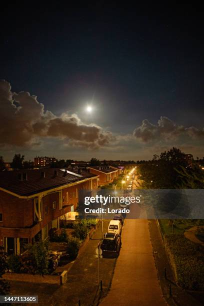 dutch city street and lights in the evening moonlight in den haag - neighborhood street light stock pictures, royalty-free photos & images