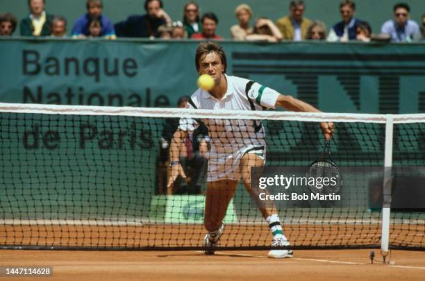 Henri Leconte from France plays a backhand drop shot over the net return to Jonas Svensson of Sweden during their Men's Singles Quarterfinal match at...