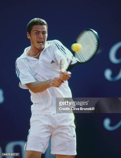 Marat Safin from Russia plays a double handed backhand return to David Nalbandian of Argentina during their Men's Singles Third Round match at the...