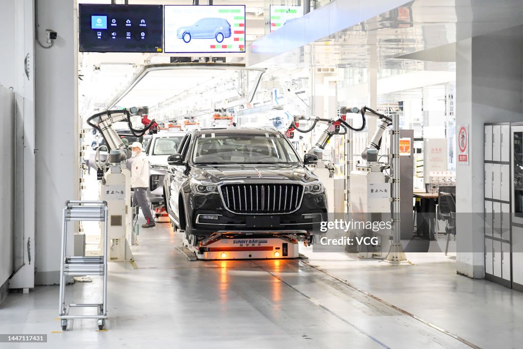 Faw Auto Employees work on the assembly line of Hongqi vehicles at a factory ...