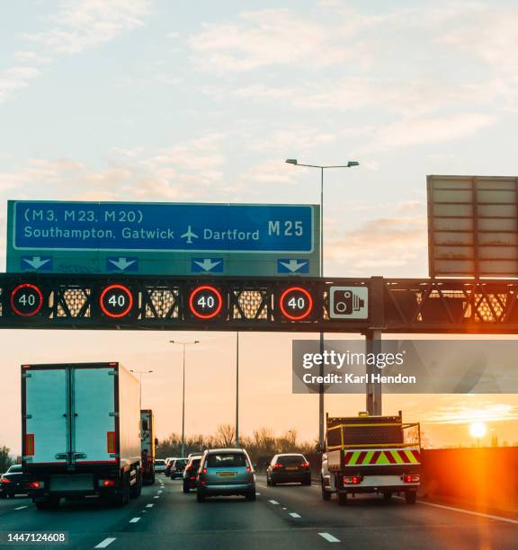 traffic on a busy multi-lane road - motorway sign stock pictures, royalty-free photos & images