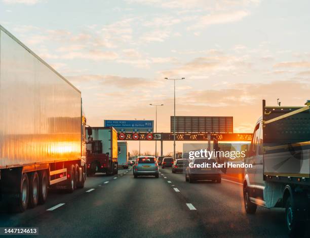 traffic on a busy multi-lane road - highways stock pictures, royalty-free photos & images