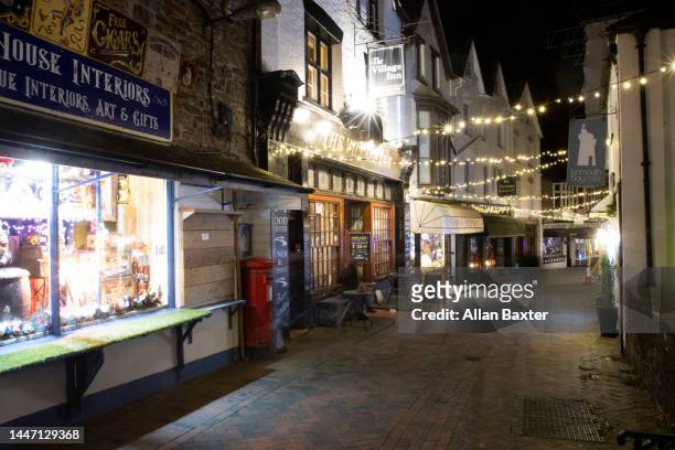 christmas lights along lynmouth high street, devon - exmoor national park night stock pictures, royalty-free photos & images