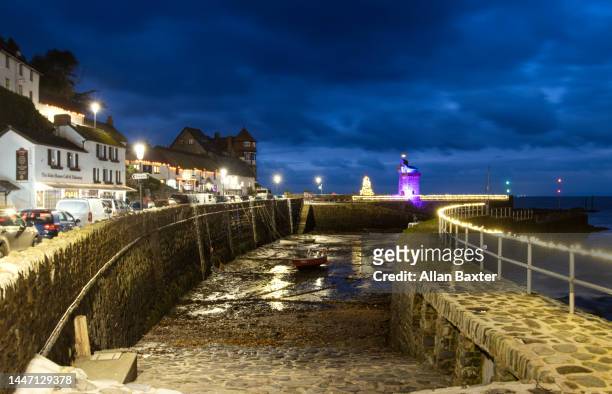 christmas lights in estuary in lynmouth, devon - exmoor national park night stock pictures, royalty-free photos & images