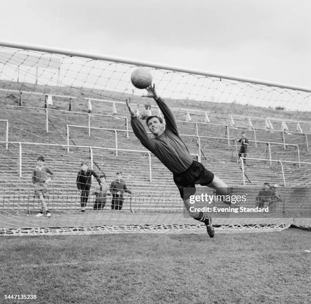 English footballer Vic Rouse making a save during training at Crystal Palace's Selhurst Park Stadium in London on August 25th, 1961.