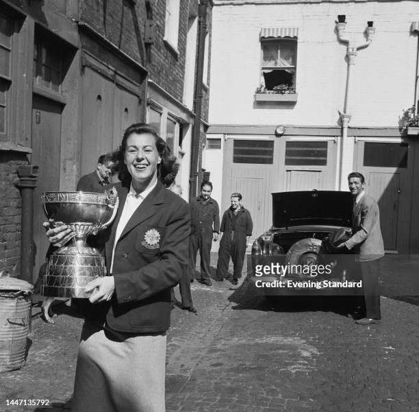 British golfer Marley Spearman holding her trophy after winning the British Ladies Amateur Championship on June 2nd, 1961.