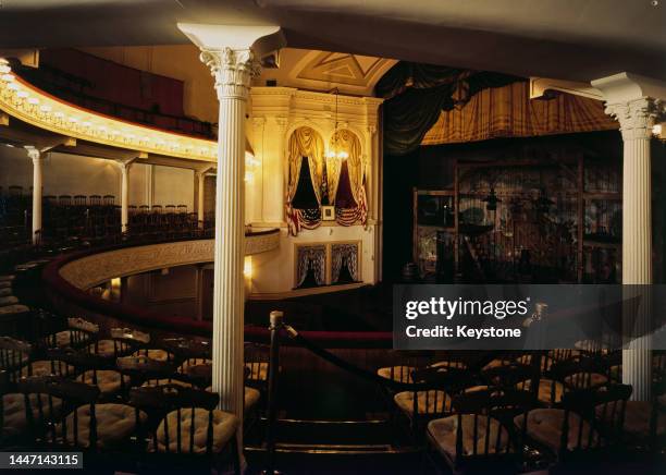 Interior view of Ford's Theatre, the presidential box being draped in two American flags, in Washington, DC circa 1975. The theatre was the site of...