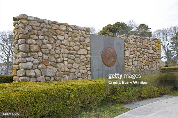 rock wall with president kennedy medallion. - hyannis port stock pictures, royalty-free photos & images