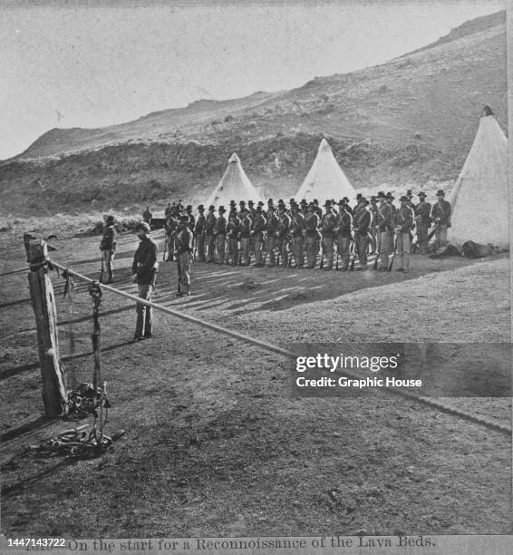 Military personnel at a military camp, with tents in the background, during the Modoc War in Siskiyou County, California, circa 1873. The Modoc War...