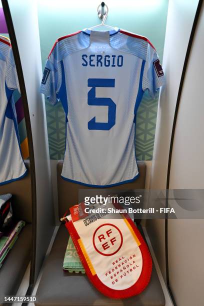 The match pennant, Education For All captain's armband and shirt of Sergio Busquets of Spain are seen in the dressing room prior to the FIFA World...