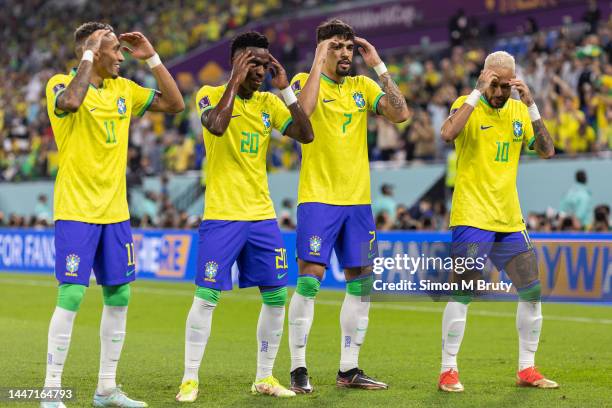 Vinicius Junior of Brazil dancing with Raphinha, Lucas Paqueta and Neymar after scoring the team's first goal during the FIFA World Cup Qatar 2022...