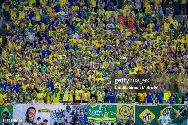 Brazil fans cheering in the stands during the FIFA World Cup Qatar 2022 Round of 16 match between Brazil and South Korea at Stadium 974 on December...