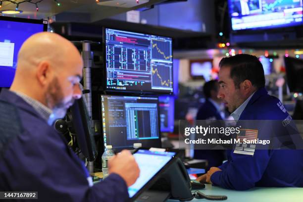 Traders work on the floor of the New York Stock Exchange during morning trading on December 06, 2022 in New York City. The Dow Jones opened low this...