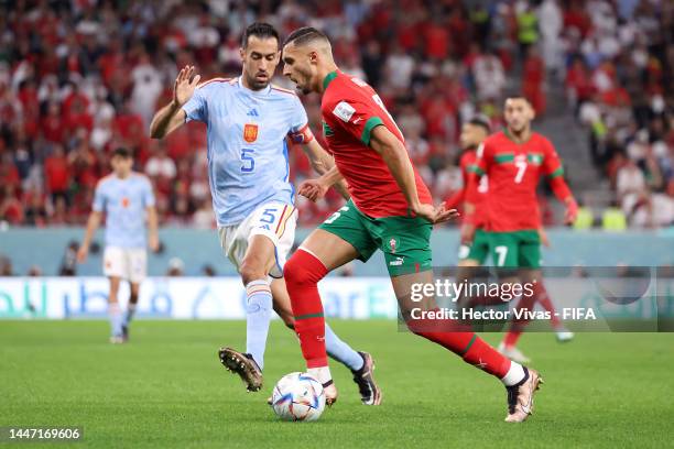 Nayef Aguerd of Morocco controls the ball against Sergio Busquets of Spain during the FIFA World Cup Qatar 2022 Round of 16 match between Morocco and...