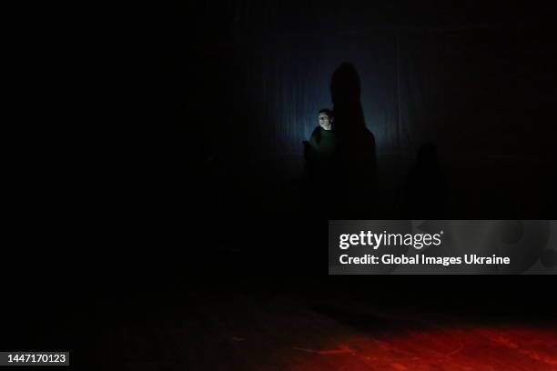 An actor plays performance on a theater stage on December 2, 2022 in Odesa, Ukraine. The premiere of a documentary performance "It is possible to...