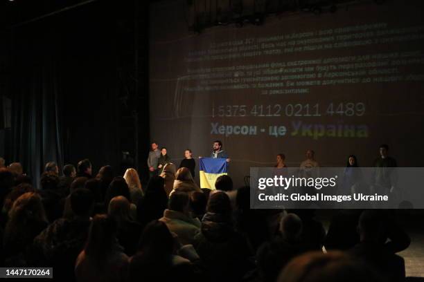 Actors came on stage at the end of a performance, holding the Ukrainian flag in their hands on December 2, 2022 in Odesa, Ukraine. The premiere of a...