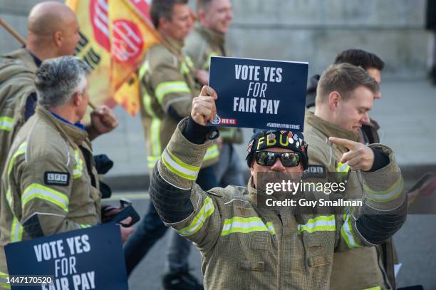 Several thousand firefighters march from their rally at Methodist Central Hall to parliament to lobby their MPs on December 6, 2022 in London,...