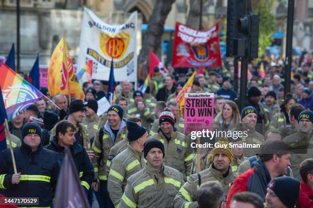 Several thousand firefighters march from their rally at Methodist Central Hall to parliament to lobby their MPs on December 6, 2022 in London,...