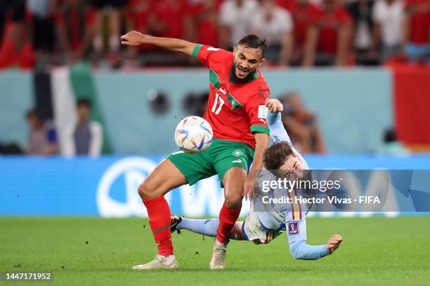 Gavi of Spain battles for possession with Sofiane Boufal of Morocco during the FIFA World Cup Qatar 2022 Round of 16 match between Morocco and Spain...