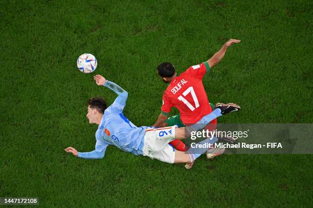 Gavi of Spain battles for possession with Sofiane Boufal of Morocco during the FIFA World Cup Qatar 2022 Round of 16 match between Morocco and Spain...