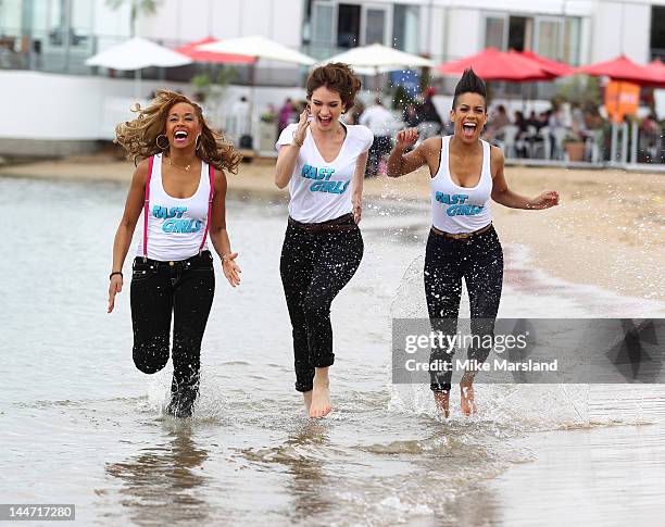 Lorraine Burroughs, Lily James and Dominique Tipper attend "Fast Girls" Photocall at 65th Annual Cannes Film Festival at UK Film Centre on May 18,...