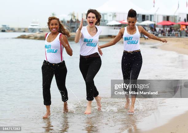Lorraine Burroughs, Lily James and Dominique Tipper attend "Fast Girls" Photocall at 65th Annual Cannes Film Festival at UK Film Centre on May 18,...