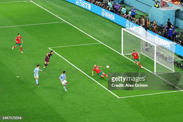 Sofyan Amrabat of Morocco defends a rebound by Spain during the FIFA World Cup Qatar 2022 Round of 16 match between Morocco and Spain at Education...