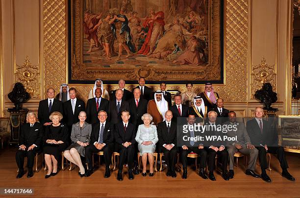Queen Elizabeth II poses for group photo with her Royal guests Emperor Akihito of Japan, Queen Beatrix of The Netherlands, Queen Margrethe II of...