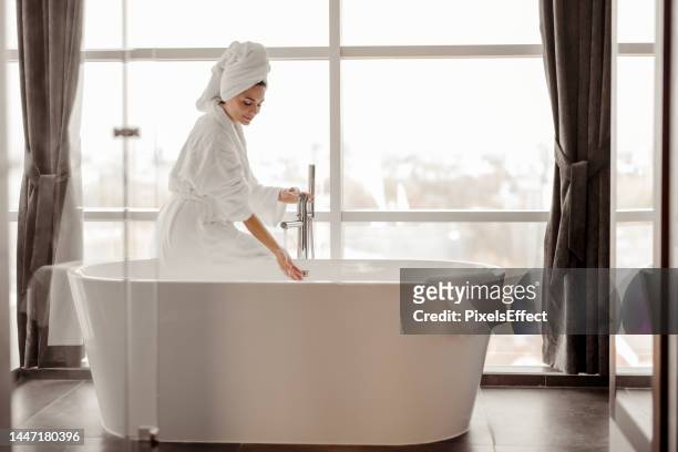 happiness is a long relaxing bath - woman shower bath imagens e fotografias de stock