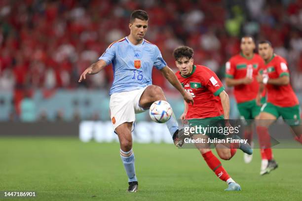 Rodri of Spain controls the ball during the FIFA World Cup Qatar 2022 Round of 16 match between Morocco and Spain at Education City Stadium on...