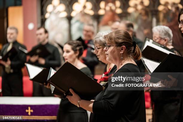 church choir during performance at concert - canada christmas stock pictures, royalty-free photos & images