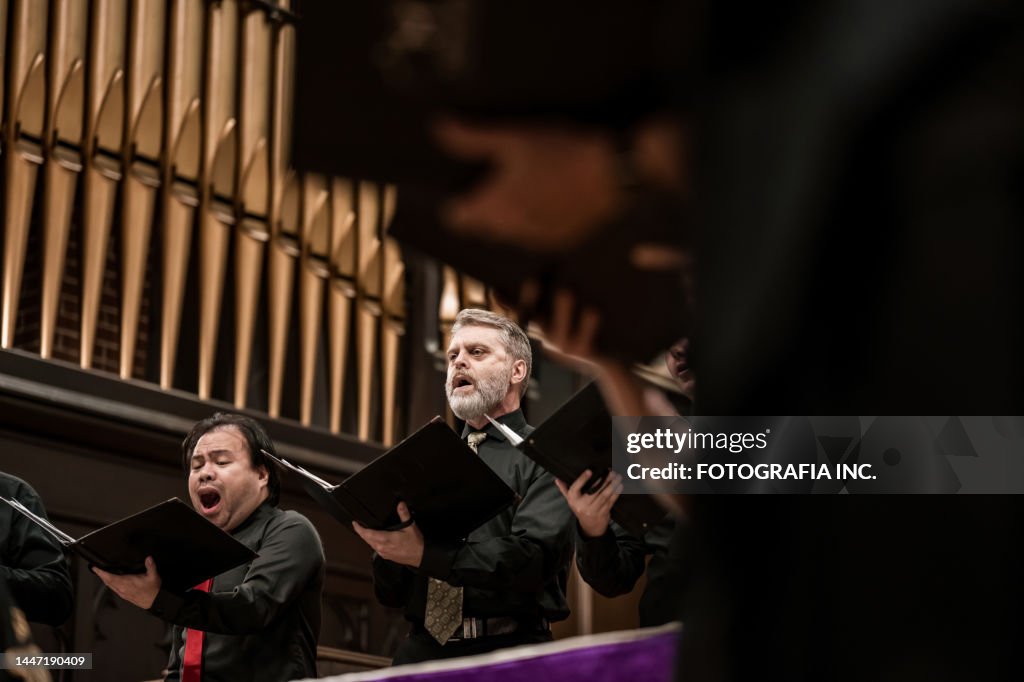 Men singers in Church Choir during performance at Concert