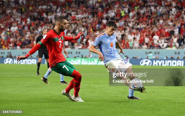 Pedri of Spain controls the ball against Hakim Ziyech of Morocco during the FIFA World Cup Qatar 2022 Round of 16 match between Morocco and Spain at...