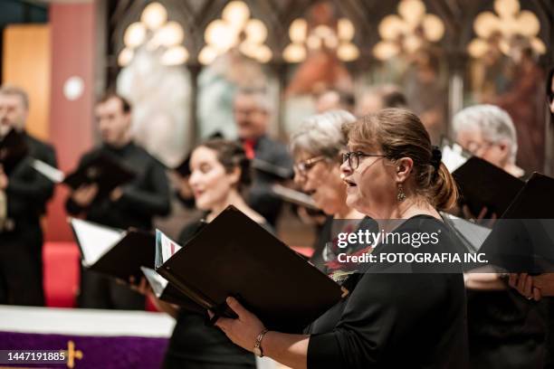 church choir during performance at concert - koor stockfoto's en -beelden
