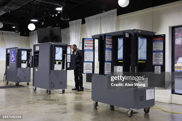 Voter casts his ballot at a polling station for the U.S. Senate runoff election on December 6, 2022 in Atlanta, Georgia. Georgians head to the polls...